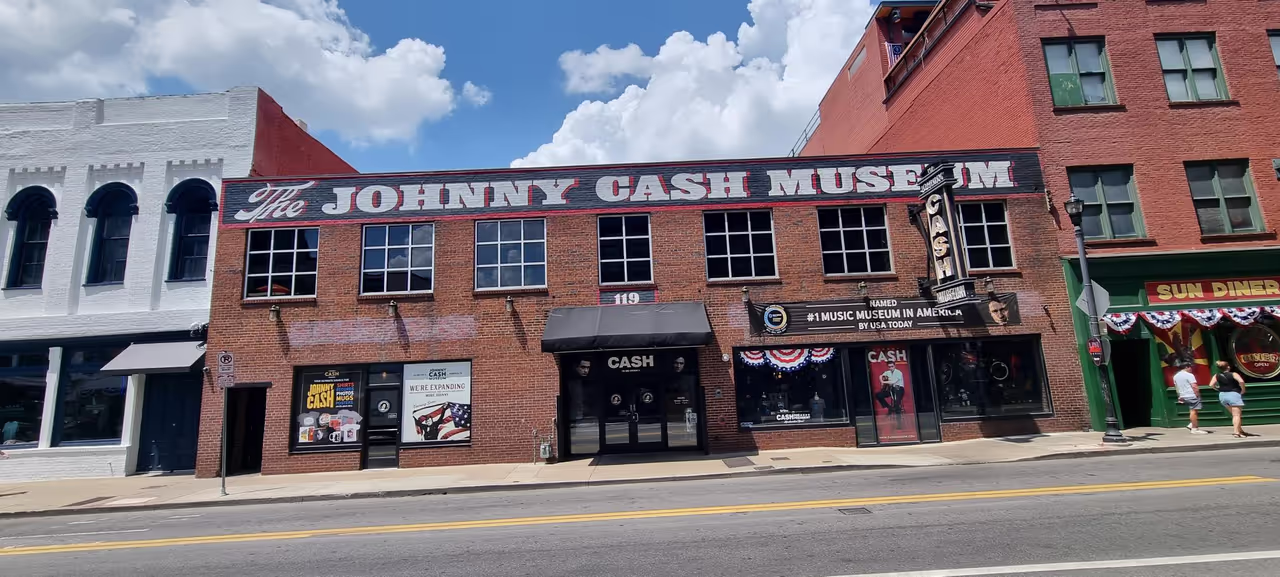 The red-brick facade of the Johnny Cash Museum on Third Avenue South in downtown Nashville under a blue summer sky